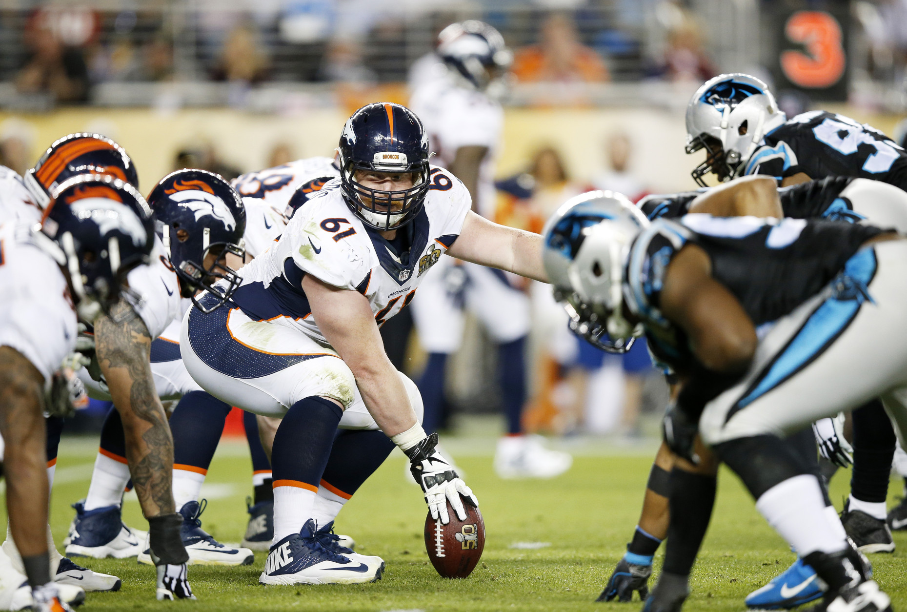 SANTA CLARA, CA - FEBRUARY 07:   Matt Paradis #61 of the Denver Broncos prepares to hike the ball against the Carolina Panthers in the fourth quarter during Super Bowl 50 at Levi's Stadium on February 7, 2016 in Santa Clara, California.  (Photo by Ezra Shaw/Getty Images)
