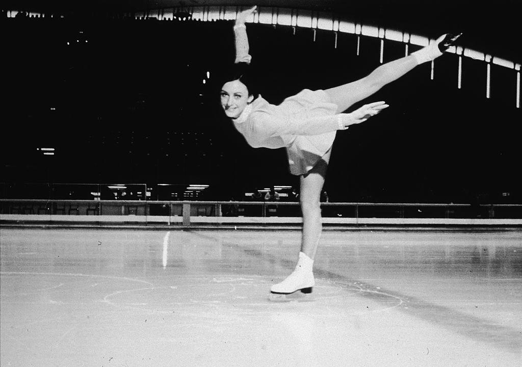 American figure skater Peggy Fleming executes a spiral on the ice rink at the 1968 Winter Olympic Games, where she won the gold medal in the women's figure skating event on February 11, Grenoble, France, February 1968. (Photo by Hulton Archive/Getty Images)