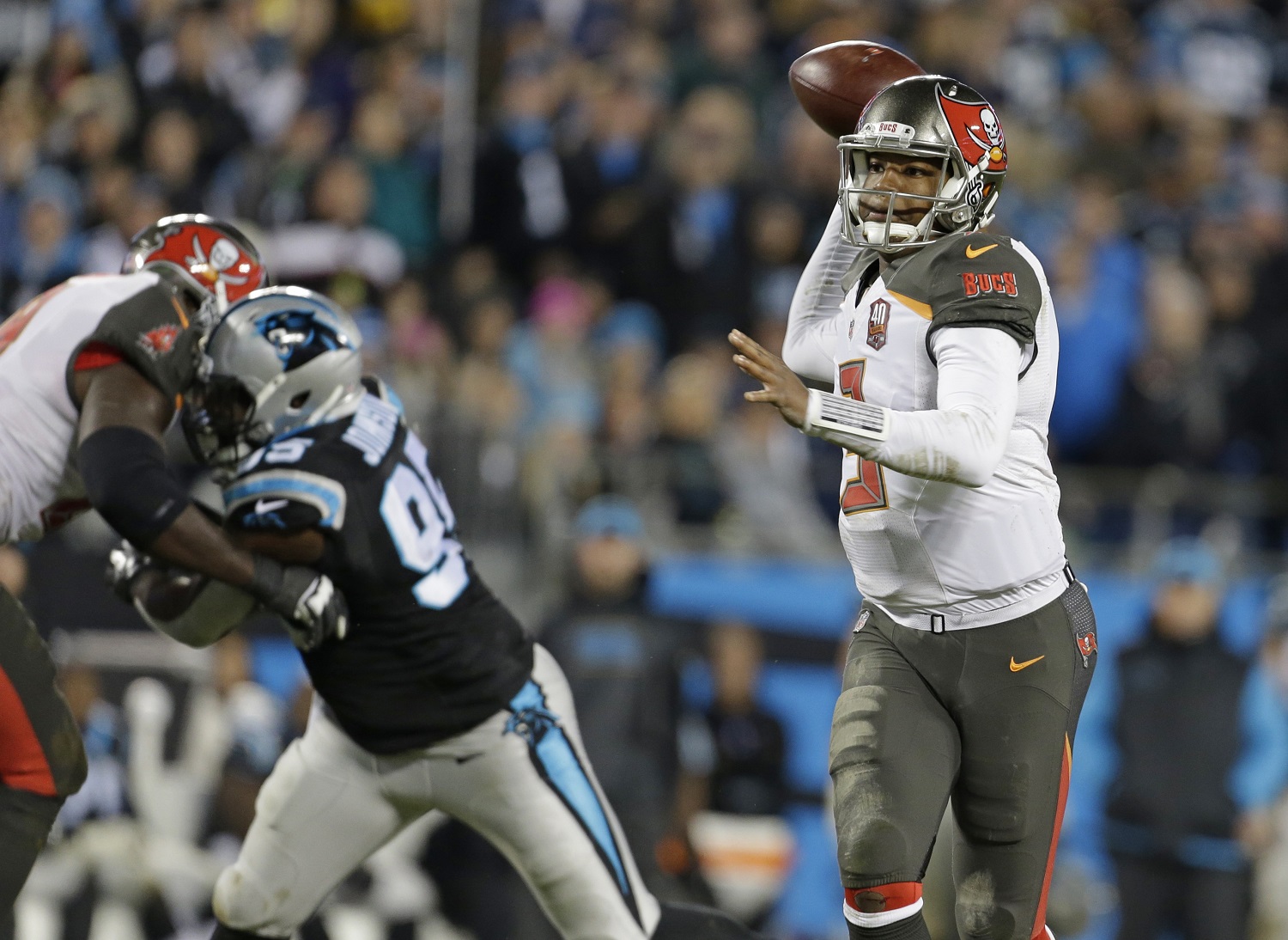 Tampa Bay Buccaneers quarterback Jameis Winston (3) looks to pass against the Carolina Panthers in the first half of an NFL football game in Charlotte, N.C., Sunday, Jan. 3, 2016. (AP Photo/Bob Leverone)
