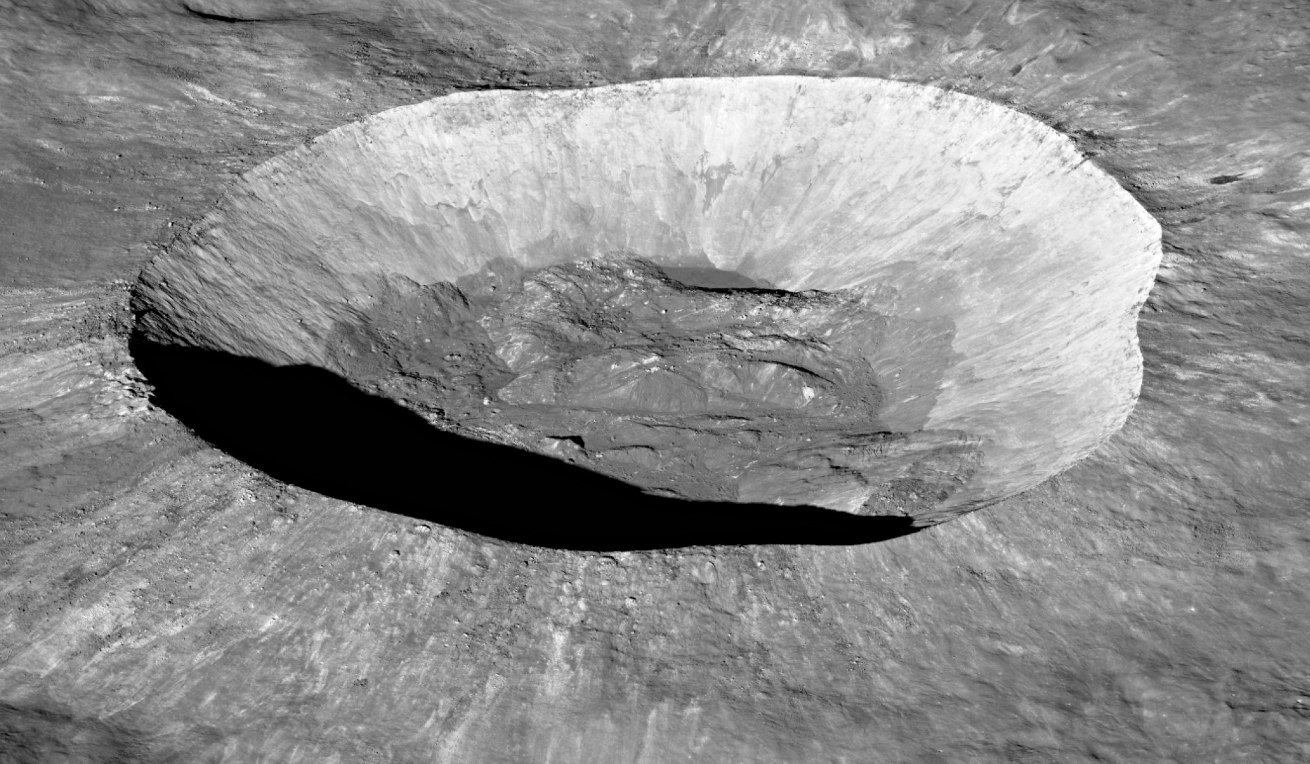 In this striking view of one of the Moon's craters, the height and sharpness of the rim are evident, as well as the crater floor's rolling hills and rugged nature. (NASA/Goddard Space Flight Center/Arizona State University)