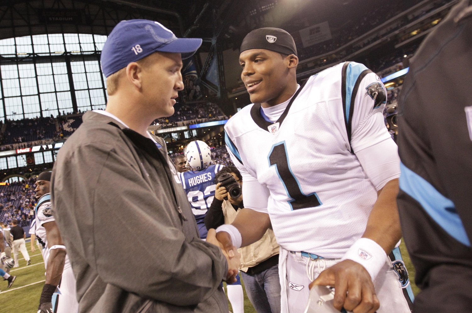 FILE - In this Nov. 27, 2011, file photo, injured Indianapolis Colts quarterback Peyton Manning meets with Carolina Panthers quarterback Cam Newton after an NFL football game in Indianapolis. For the next two weeks, until Peyton Manning's AFC champion Denver Broncos face Cam Newton's NFC champion Carolina Panthers in the 50th Super Bowl in Santa Clara, California, most of the focus will be on the two quarterbacks who were No. 1 overall draft picks 13 years apart. (AP Photo/AJ Mast, File)