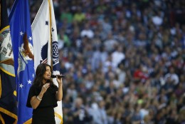 Idina Menzel sings the national anthem before the NFL Super Bowl XLIX football game between the Seattle Seahawks and the New England Patriots Sunday, Feb. 1, 2015, in Glendale, Ariz.  (AP Photo/Matt York)