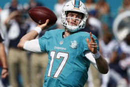 Miami Dolphins quarterback Ryan Tannehill (17) looks to pass during the first half of an NFL football game against the New England Patriots, Sunday, Jan. 3, 2016 in Miami Gardens, Fla. (AP Photo/Wilfredo Lee)