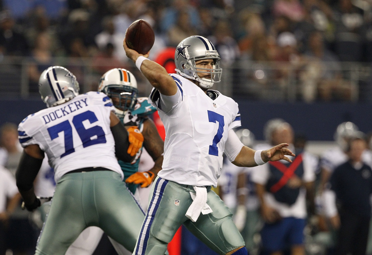 Dallas Cowboys' Derrick Dockery (76) provides coverage as Stephen McGee (7) passes against the Miami Dolphins in the first half of a preseason NFL football game Wednesday, Aug. 29, 2012, in Arlington, Texas. (AP Photo/Tony Gutierrez)