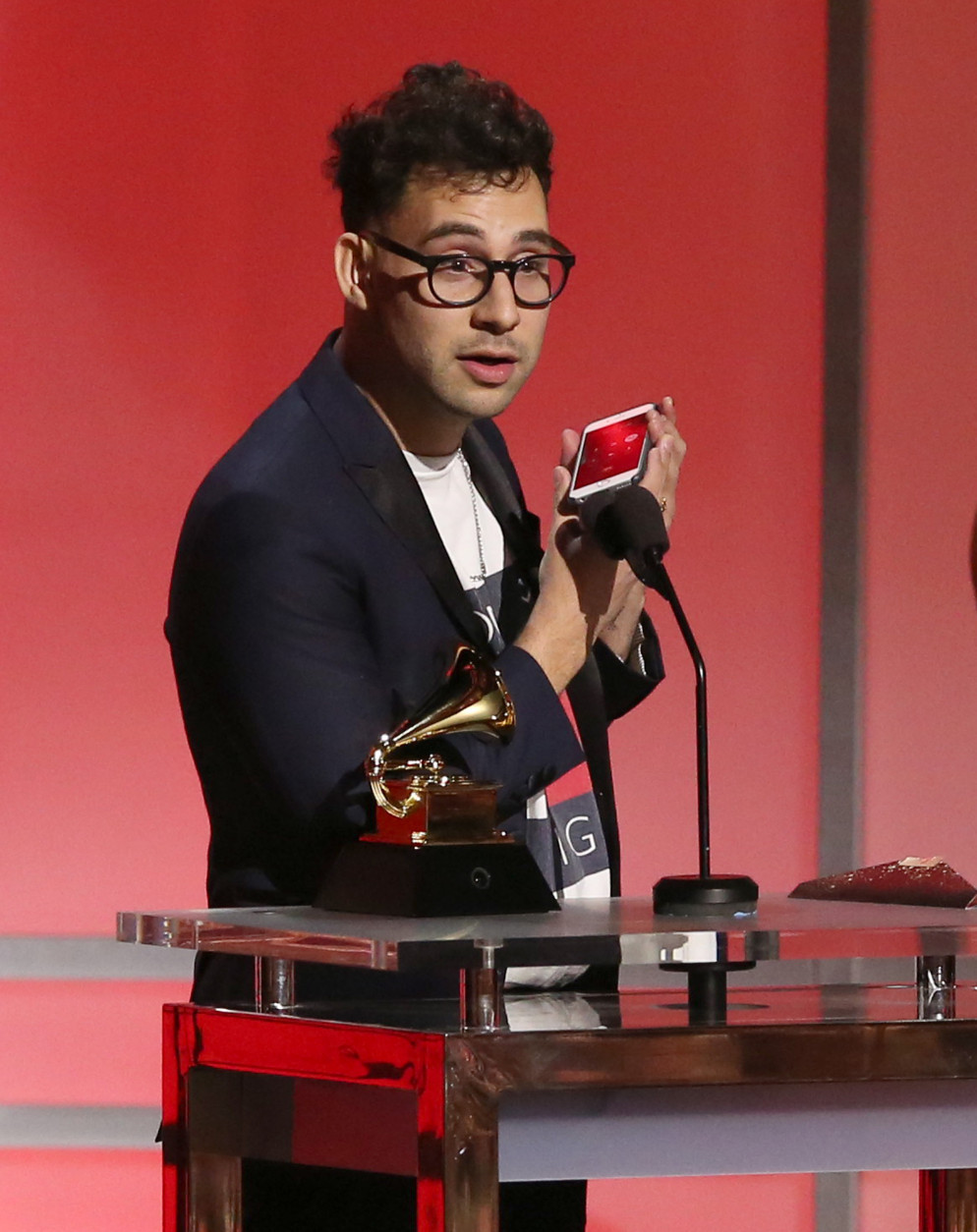 Jack Antonoff calls Taylor Swift as he accepts their award for pop vocal album at the 58th annual Grammy Awards on Monday, Feb. 15, 2016, in Los Angeles. (Photo by Matt Sayles/Invision/AP)