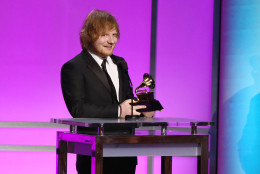 Ed Sheeran accepts the award for best pop solo performance for Thinking Out Loud at the 58th annual Grammy Awards on Monday, Feb. 15, 2016, in Los Angeles. (Photo by Matt Sayles/Invision/AP)