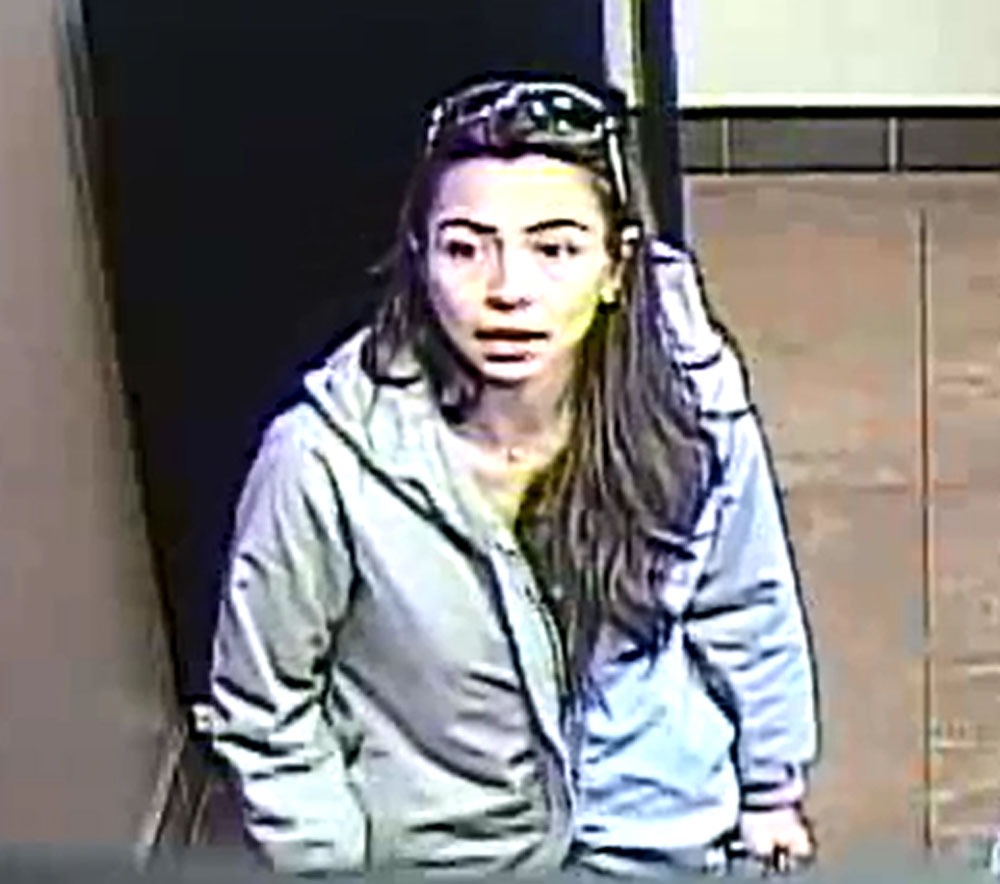 Police say this woman is a suspect in a purse theft at a Dunkin’ Donuts in Falls Church, Virginia. (Courtesy Fairfax County Police Department)