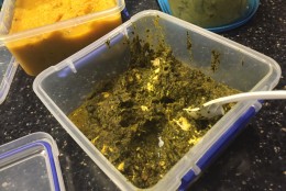 Web Editor Rick Massimo brings international flavor to the American title game with Saag Paneer, which is spinach and cheese. (WTOP/Neal Augenstein)