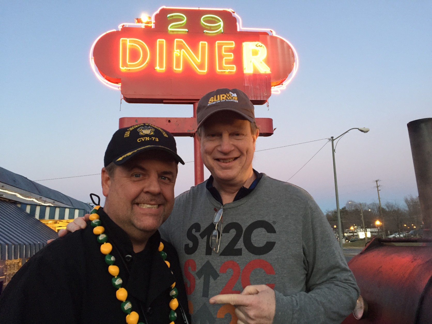 The owner of 29 Diner, John Wood (left), with friend and cancer survivor Pat Malone. (WTOP/Michelle Basch)