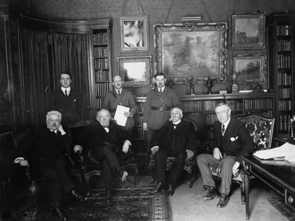 FRANCE - 1919:  Peace Conference attendees (seated, L-R) Italian Premier Vittorio Orlando, British PM David Lloyd George, French Premier Georges Clemenceau &amp; US President Woodrow Wilson meeting at Wilson's Paris home prior to the signing of the Versailles Treaty.  (Photo by US Army Signal Corps/US Army Signal Corps/The LIFE Picture Collection/Getty Images)