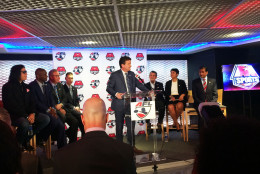 WTOP Senior Sports Director Dave Johnson (center) served as MC for the event, which included (from left to right) KISS frontman and AFL owner Gene Simmons, NFL Hall of Famer and AFL team GM Derrick Brooks, former NFL quarterback and part AFL owner Ron Jaworski, AFL Commissioner Scott Butera, Ted Leonsis, D.C. Mayor Muriel Bowser and Washington Team GM Roger Mody.