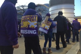 Workers protest at Reagan National Airport on March 31, 2016. (WTOP/Nick Iannelli)