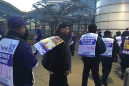 Workers protest at Reagan National Airport on March 31, 2016. (WTOP/Nick Iannelli)