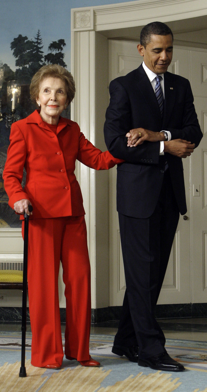 President Barack Obama escorts former first lady Nancy Reagan into the Diplomatic Reception Room of the White House in Washington, Tuesday, June 2,2009, before signing the Ronald Reagan Centennial Commission Act. (AP Photo/Haraz N. Ghanbari)