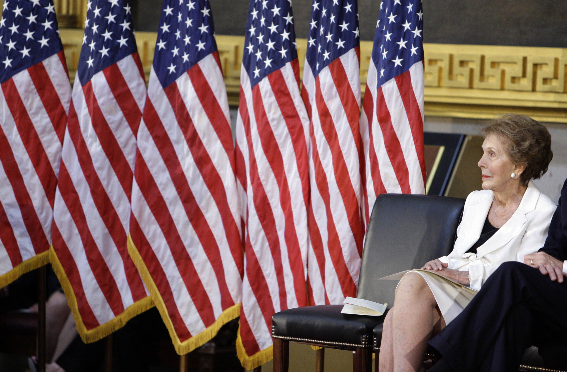 Former first lady Nancy Reagan sits in the Capitol Rotunda in Washington, Wednesday, June 3, 2009, during a ceremony to unveil a bronze statue of President Ronald Reagan. (AP Photo/Alex Brandon)