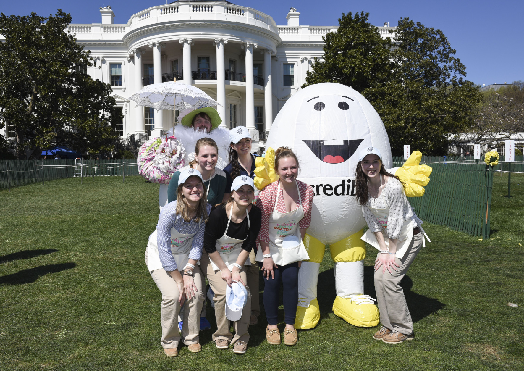 AEB "Abe" The American Egg Board mascot, right, poses with volunteers at the White House Easter Egg Roll festivities on the White House South Lawn in Washington, Monday, March 28, 2016. (Kevin Wolf/AP Images for American Egg Board)
