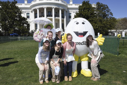 AEB "Abe" The American Egg Board mascot, right, poses with volunteers at the White House Easter Egg Roll festivities on the White House South Lawn in Washington, Monday, March 28, 2016. (Kevin Wolf/AP Images for American Egg Board)