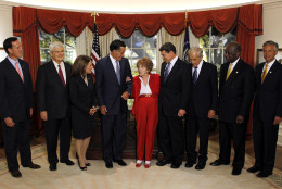 Republican presidential candidates are greeted by former first lady Nancy Reagan, center, before a Republican presidential candidate debate at the Reagan Library Wednesday, Sept. 7, 2011, in Simi Valley, Calif. From left are, former Pennsylvania Sen. Rick Santorum, former House Speaker Newt Gingrich, Rep. Michele Bachmann, R-Minn., former Massachusetts Gov. Mitt Romney, Texas Gov. Rick Perry, Rep. Ron Paul, R-Texas, businessman Herman Cain and former Utah Gov. Jon Huntsman. (AP Photo/Chris Carlson, Pool)