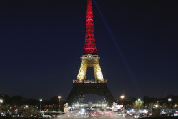 The Eiffel Tower is illuminated with the Belgium national colors black, yellow and red in honor of the victims of the today's attacks at the airport and the metro station in Brussels, in Paris, Tuesday, March 22, 2016. Explosions, at least one likely caused by a suicide bomber, rocked the Brussels airport and its subway system Tuesday, prompting a lockdown of the Belgian capital and heightened security across Europe. (AP Photo/Thibault Camus)