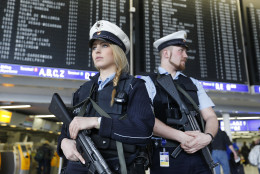 German police officers guard  a terminal of the airportthe  in Frankfurt, Germany, during tighter security measures  Tuesday, March 22, 2016, when various explosions hit the  Belgian capital  Brussels killing several people. (AP Photo/Michael Probst)