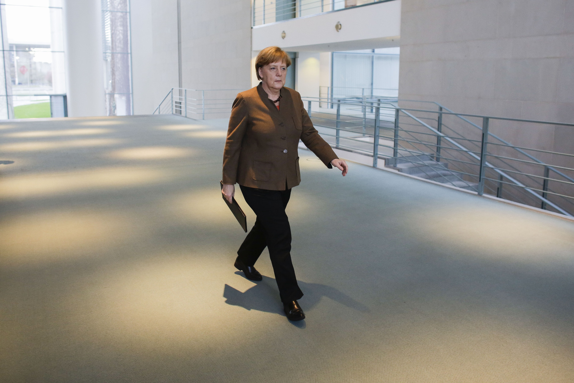 German Chancellor Angela Merkel arrives for a statement on the  attacks in Brussels at the chancellery in Berlin, Germany, Tuesday, March 22, 2016. (AP Photo/Markus Schreiber)