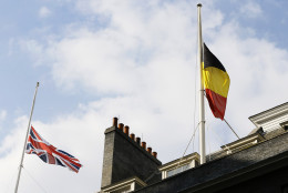 The Belgium and British flag fly at half staff above Downing Street in London, following the attacks in Brussels, Tuesday, March, 22, 2016. Authorities in Europe and beyond have tightened security at airports, on subways, at the borders and on city streets after deadly attacks Tuesday on the Brussels airport and its subway system. (AP Photo/Kirsty Wigglesworth)