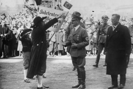 During a ceremony in Vienna on March 15, 1938 a delegation of Sudeten Germans greet Adolf Hitler and Dr. Arthur Seyss-Inquart, right. (AP Photo) --- Waehrend einer Feier auf den Heldenplatz in Wien am 15. Maerz, 1938 gruessen die Sudetendeutsche Abordnung Adolf Hitler. Rechts von Adolf Hitler steht der Reichsstatthalter Dr. Seyss-Inquart. Adolf Hitler verkuendet auf dem Heldenplatz den "Anschluss" Oesterreichs an Deutschland. (AP Photo)