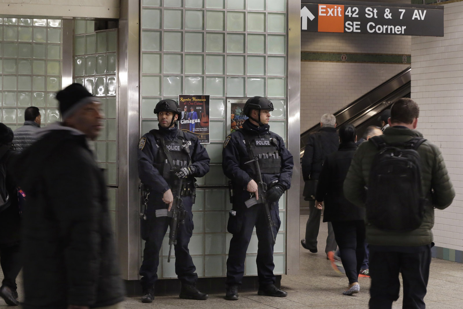 A pair of New York City Police Transit officers patrol in New York the subway station in Times Square,  Tuesday, March 22, 2016. Authorities are increasing security throughout New York City following explosions at the airport and subway system in the Belgian capital of Brussels.  (AP Photo/Richard Drew)