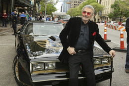 Burt Reynolds sits on a 1977 Pontiac Trans-Am at the world premiere of "The Bandit" at the Paramount Theatre during the South by Southwest Film Festival on Saturday, March 12, 2016, in Austin, Texas. (Photo by Jack Plunkett/Invision/AP)