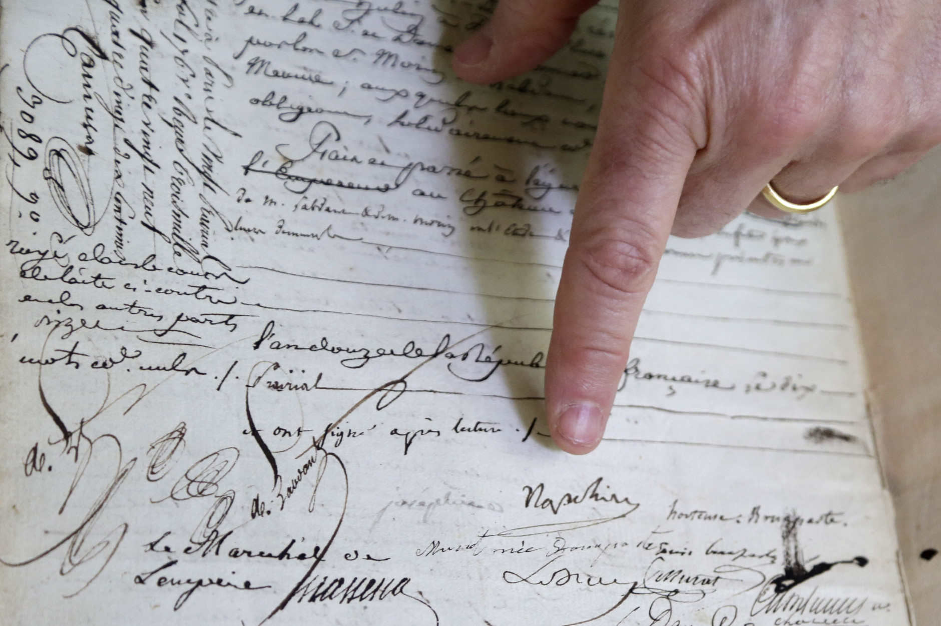 In this Monday, Feb. 8, 2016 photo, David Lowenherz  points to the signatures of Napoleon Bonaparte and to the left, Josephine de Beauharnais, on a marriage contract, in West Palm Beach, Fla.  Lowenherz, of Lion Heart Autographs, will put the document up for sale this week at the Palm Beach Jewelry, Art &amp; Antique Show. (AP Photo/Lynne Sladky)