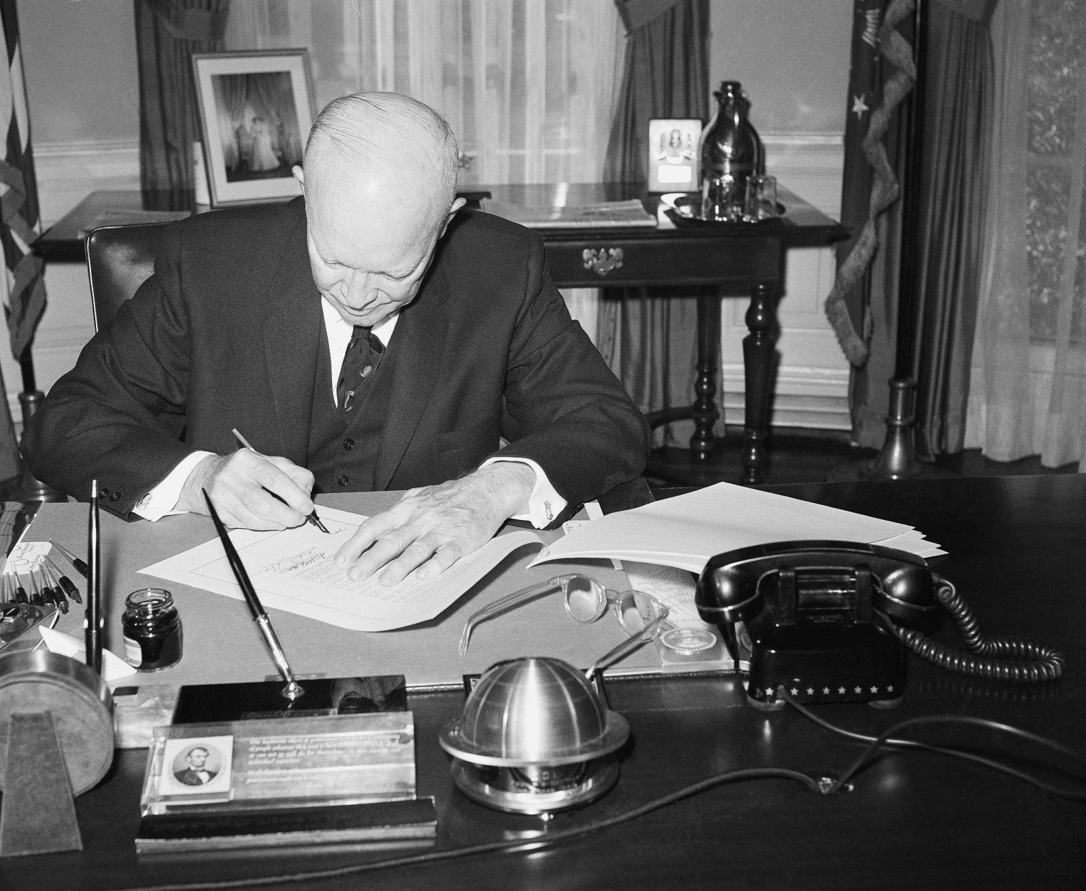 President Dwight  Eisenhower signs the bill to make Hawaii the 50th State at the White House on March 17, 1959 in Washington. The chief executive used several pens in placing his signature on the measure. (AP Photo/Charles Gorry)