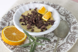 This Sept. 29, 2014 photo shows orange zest pudding with dark chocolate shavings in Concord, N.H. Orange zest, the thin outer skin of an orange, has fragrant and flavorful oils that can add sweetness to dishes. (AP Photo/MatthewMead)
