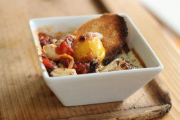 This Sept. 21, 2015, photo shows baked eggs in sweet pepper sauce in Concord, N.H. The sauce for these baked eggs uses healthy fast foods you can keep in your pantry, such as jarred roasted red peppers and simple marinara sauce. (AP Photo/Matthew Mead)