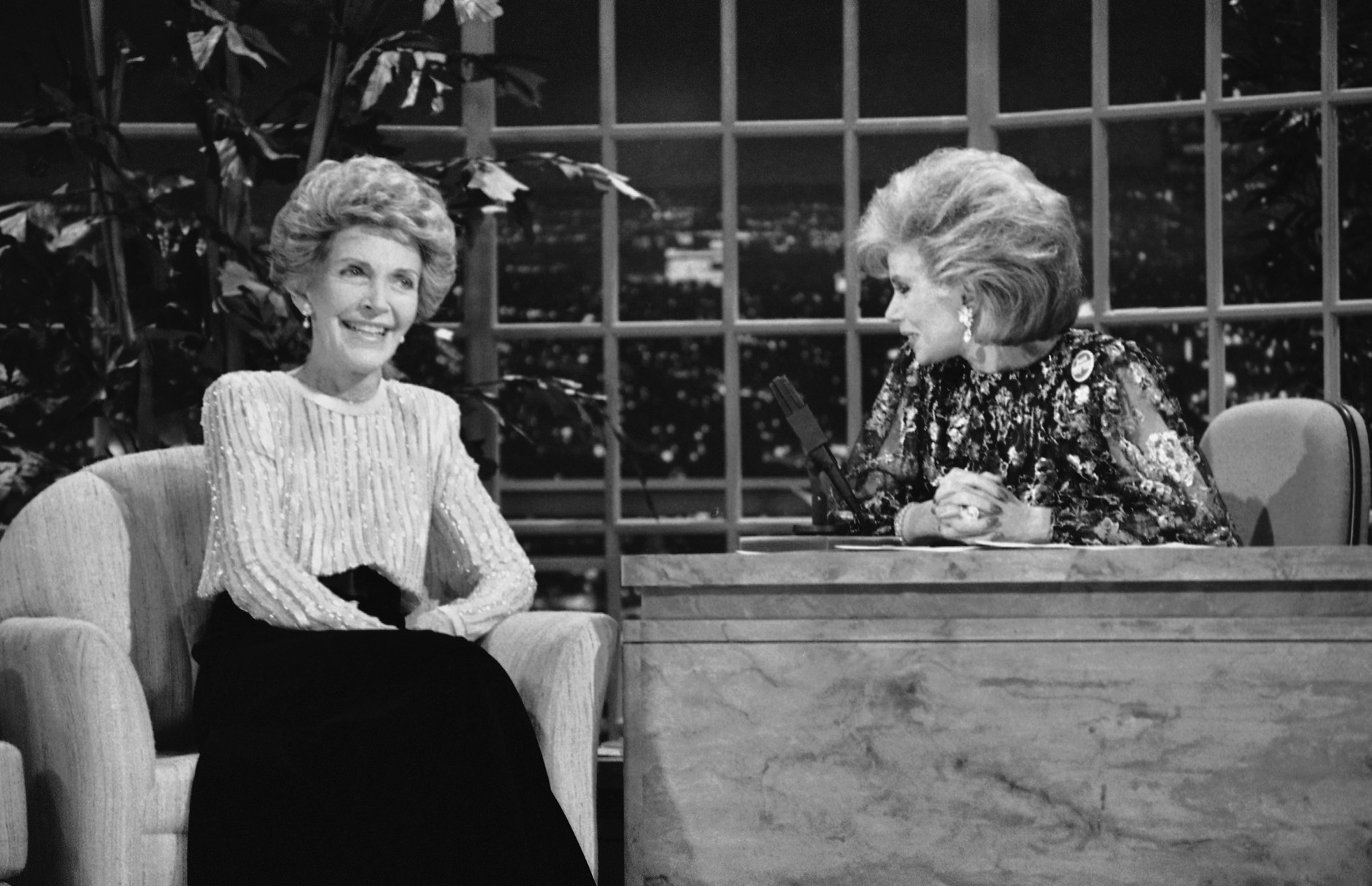 FILE - In this Oct. 30, 1986 file photo, talk show host Joan Rivers, right, talks with guest, first lady Nancy Reagan, during her appearance on "The Late Show Starring Joan Rivers," in Los Angeles. Rivers, the raucous, acid-tongued comedian who crashed the male-dominated realm of late-night talk shows and turned Hollywood red carpets into danger zones for badly dressed celebrities, died Thursday, Sept. 4, 2014. She was 81. Rivers was hospitalized Aug. 28, after going into cardiac arrest at a doctor's office. (AP Photo, Reed Saxon, File)