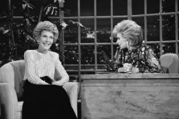 FILE - In this Oct. 30, 1986 file photo, talk show host Joan Rivers, right, talks with guest, first lady Nancy Reagan, during her appearance on "The Late Show Starring Joan Rivers," in Los Angeles. Rivers, the raucous, acid-tongued comedian who crashed the male-dominated realm of late-night talk shows and turned Hollywood red carpets into danger zones for badly dressed celebrities, died Thursday, Sept. 4, 2014. She was 81. Rivers was hospitalized Aug. 28, after going into cardiac arrest at a doctor's office. (AP Photo, Reed Saxon, File)