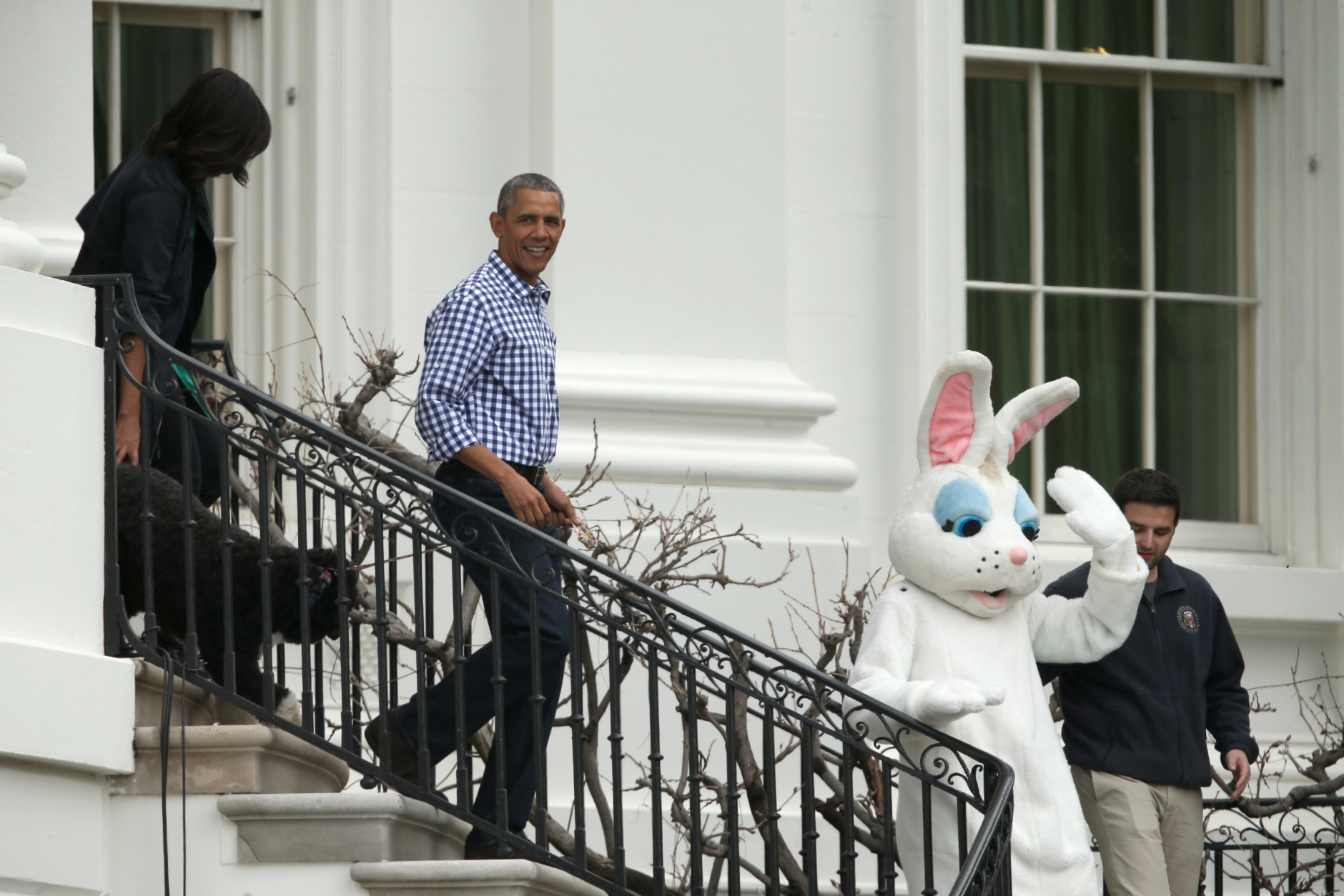 President Barack Obama and first lady Michelle Obama follow the Easter Bunny to the South Lawn of the White House in Washington, Monday, March 28, 2016, for the annual White House Easter Egg roll.  (AP Photo/Andrew Harnik)