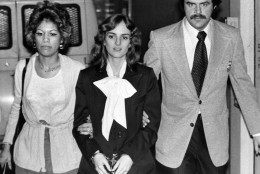 U.S. marshals escort Patricia Hearst from San Francisco's Federal Building in San Francisco, Feb. 3, 1976, where jury selection continued in her bank robbery trial. The jury is expected to be seated on Tuesday, raising the possibility the first testimony would be hears on Wednesday  the second anniversary of Miss Hearsts kidnapping by the Symbionese Liberation Army. At left is Marshal Janey Jimenez, and at right is Marshal Mike Tarr. (AP Photo)