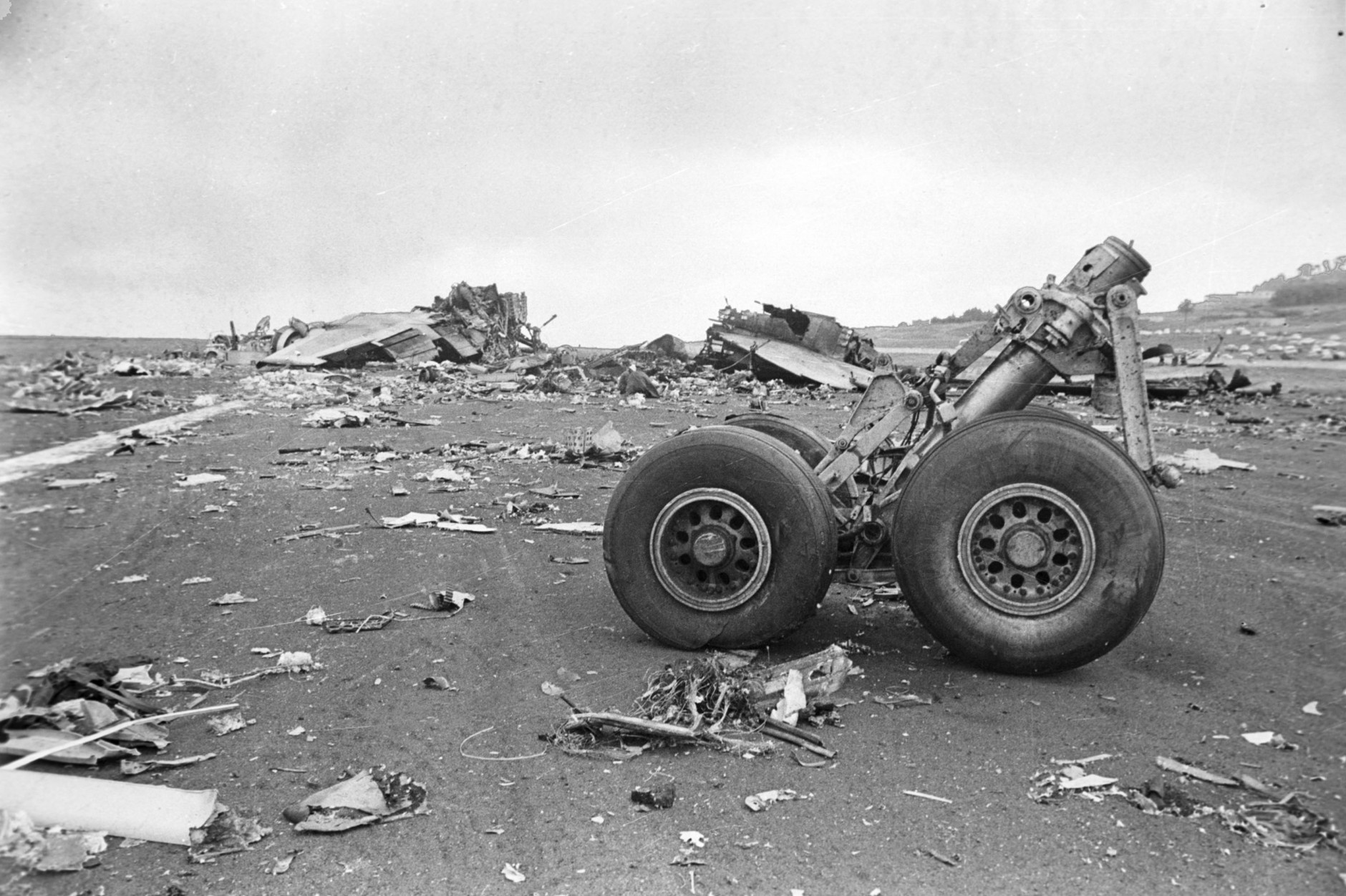 The wreckage of the Pan American World Airways 747 aircraft and KLM Boeing 747 jumbo are scattered over the runway at the airport in Santa Cruz de Tenerife, Canary Islands, Spain, Monday, March 28, 1977.  The collision between the two planes killed 583 people on board.  (AP Photo)