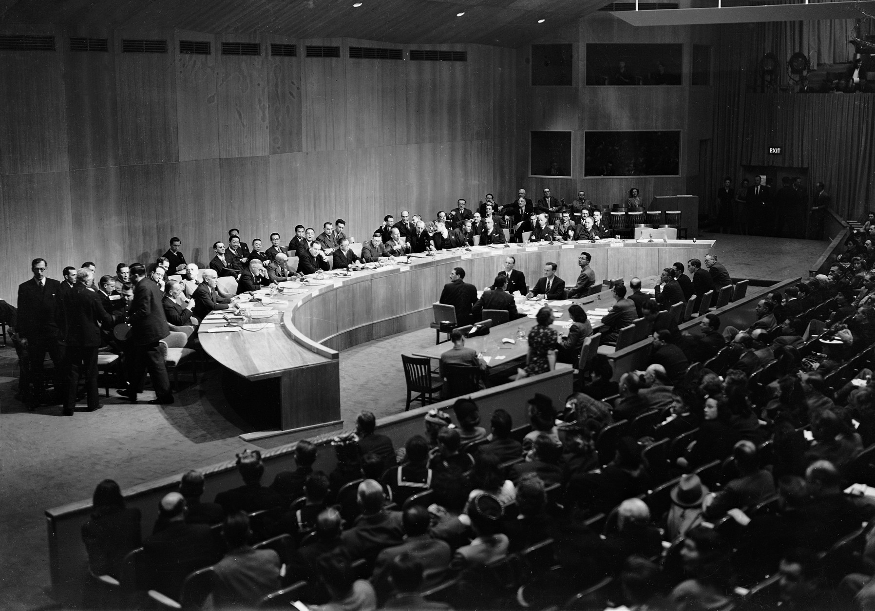 United States Secretary of State James F. Byrnes, seated third at table, watches as Andrei Gromyko, Russian Delegate, standing second from left, leads the Russian delegation from the United Nations Security Council meeting at Hunter College in New York City, March 27, 1946. Standing at left is Prof. Bons Stein, chief Soviet adviser. Seated on Byrnes right are: Edward R. Stettinius, Jr. of the U.S. and Sir Alexander George Montagu Cadogan of the United Kingdom. (AP Photo)