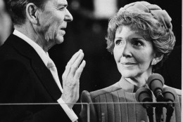 Nancy Reagan proudly watches as her husband Ronald Reagan takes the oath of office at the Capitol January 20, 1981.  (AP Photo)
