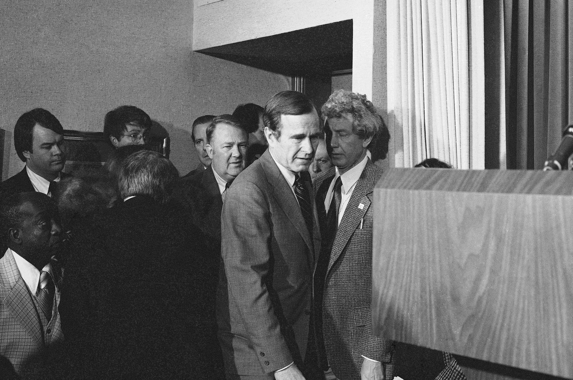 Vice President George Bush, followed by White House Chief of Staff Edwin Meese III, arrives for an appearance before reporters at the White House in Washington, March 30, 1981. The vice president interrupted a trip to Texas after the shooting of President Ronald Reagan. (AP Photo)