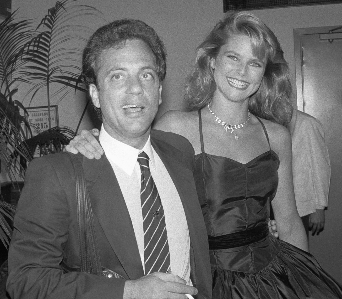 Model Christie Brinkley arrives with singer Billy Joel for a surprise birthday party in his honor at New York's Water Club, May 10, 1983. It was Joel's 34th birthday. (AP Photo/Ron Frehm)