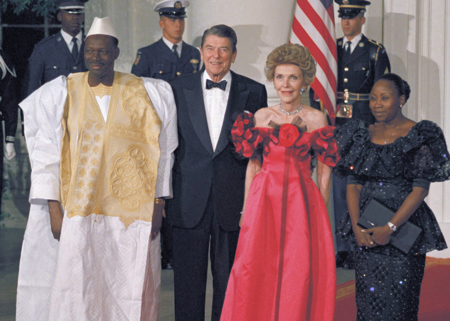 From left, Mali President Moussa Traore of Maii, joins President Ronald Reagan, Nancy Reagan, and Mariam Traore, wife of the Mali president, on arrival at the White House on Thursday, Oct. 6, 1988 in Washington.  The Mali president and his wife were greeted at the front entrance of the  White House for a state dinner in their honor. (AP Photo/J. Scott Applewhite)