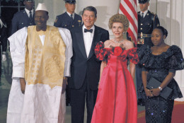 From left, Mali President Moussa Traore of Maii, joins President Ronald Reagan, Nancy Reagan, and Mariam Traore, wife of the Mali president, on arrival at the White House on Thursday, Oct. 6, 1988 in Washington.  The Mali president and his wife were greeted at the front entrance of the  White House for a state dinner in their honor. (AP Photo/J. Scott Applewhite)