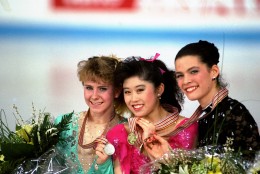 American skaters (L to R) Tonya Harding, silver; Kristi Yamaguchi, gold; and Nancy Kerrigan, bronze, display their medals after the finals of the World Figure Skating Championships in Munich, Saturday, March 12, 1991. (AP Photo/Diether Endlicher)