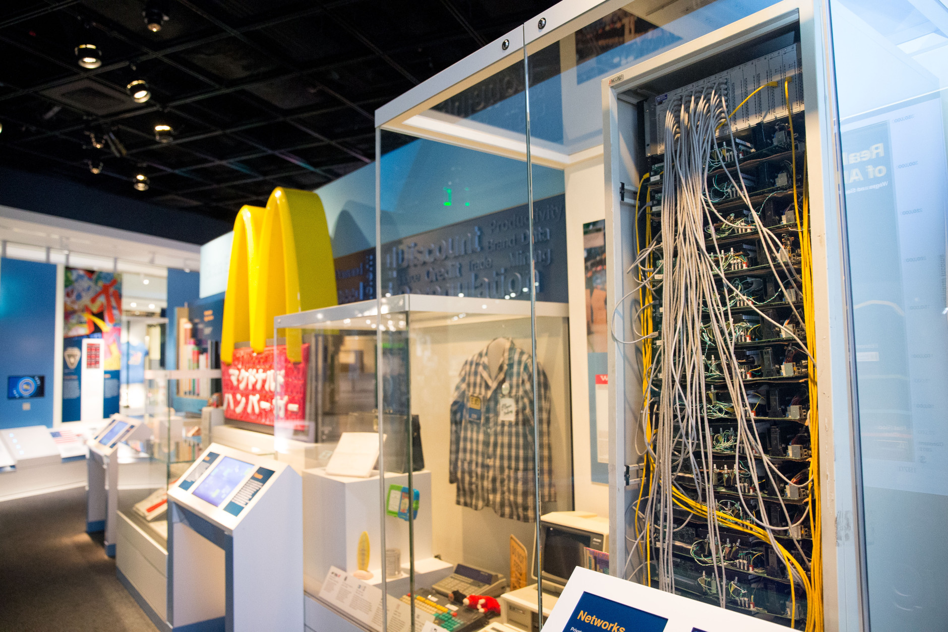 In this photo taken June 16, 2015, a cork board server, right, made by Google founders Larry Page and Sergey Brin in 1999, is displayed at the American Enterprise exhibit at the Smithsonian's National Museum of American History in Washington. A wide range of innovations from Eli Whitneys cotton gin to the early Google servers will help tell the story of American business history for the first time at the Smithsonian. The Smithsonians National Museum of American History will open its new innovation wing on July 1. It will galleries featuring U.S. inventions, money and hands-on activities. A major exhibition about American Enterprise will trace the interaction of capitalism and democracy since the mid-1700s.  (AP Photo/Andrew Harnik)