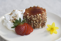 This Mar, 3 2014 photo shows lemon olive oil mini cakes with pecans and strawberries in Concord, N.H. (AP Photo/Matthew Mead)