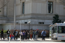 WASHINGTON, DC - MARCH 16:  People stand at a bus stop on Pennsylvania Ave., March 16, 2016 in Washington, DC. Metrorail has shut down service entirely today for emergency inspections of the system's third-rail power cables after a tunnel fire earlier in the week.   (Photo by Mark Wilson/Getty Images)