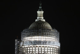 Workers have started to remove the scaffolding that surrounds the dome of the US Capitol that is undergoing restoration, on March 22, 2016 in Washington, DC. The restoration of the cast iron dome is expected to take two years and cost as much as 60 million dollars  (Photo by Mark Wilson/Getty Images)
