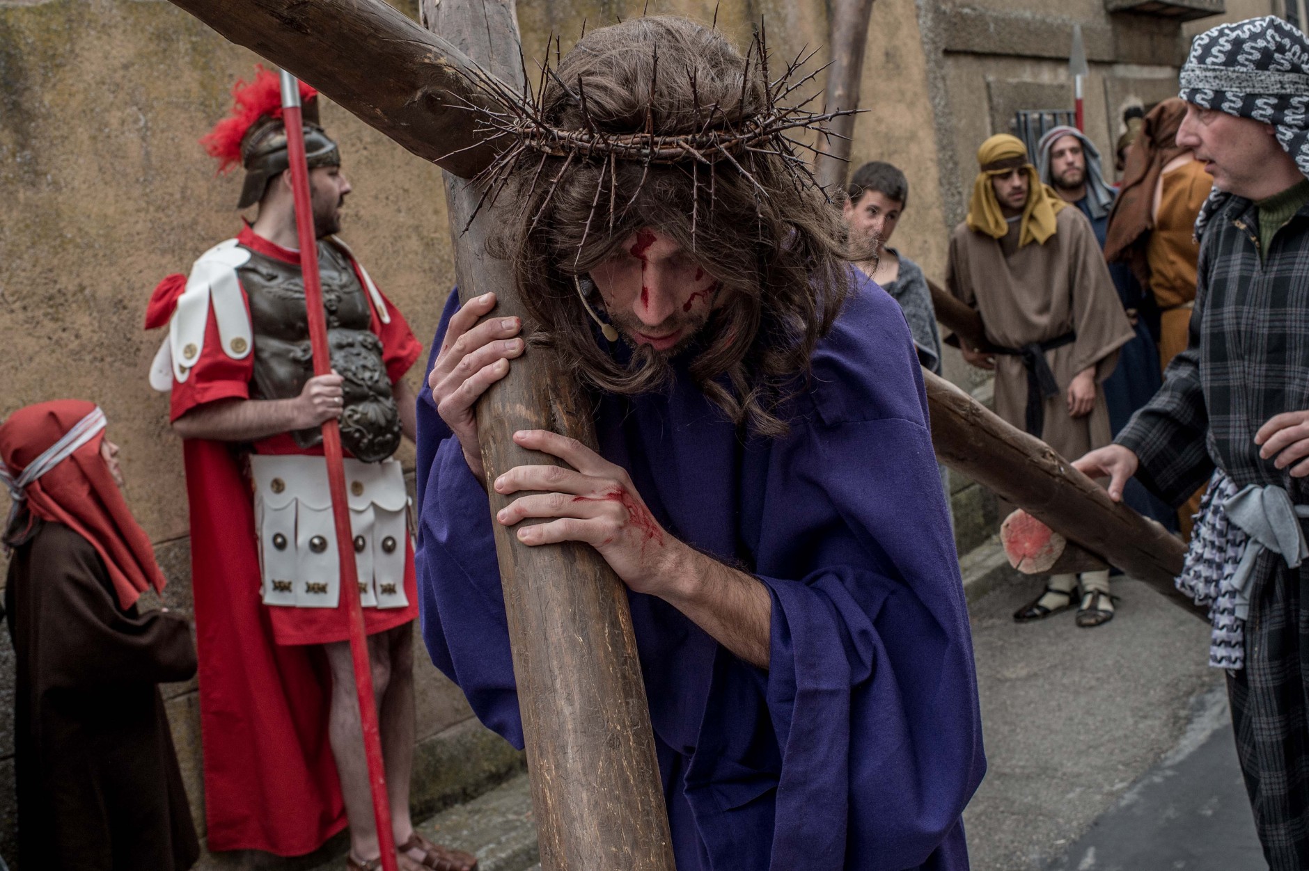 HIENDELAENCINA, SPAIN - MARCH 25:  An actor portrays Jesus Christ as residents of Hiendelaencia gather before starting the reenactment of Christ's suffering on March 25, 2016 in Hiendelaencina, Spain. The 140 village's residents celebrate every year on Good Friday a reenactment of Christ's suffering before being nailed to the cross. Hiendelaencina's inhabitants use their own funds to make the stages and wardrobe. Spain celebrates holy week before Easter with processions in most Spanish towns and villages.  (Photo by David Ramos/Getty Images)
